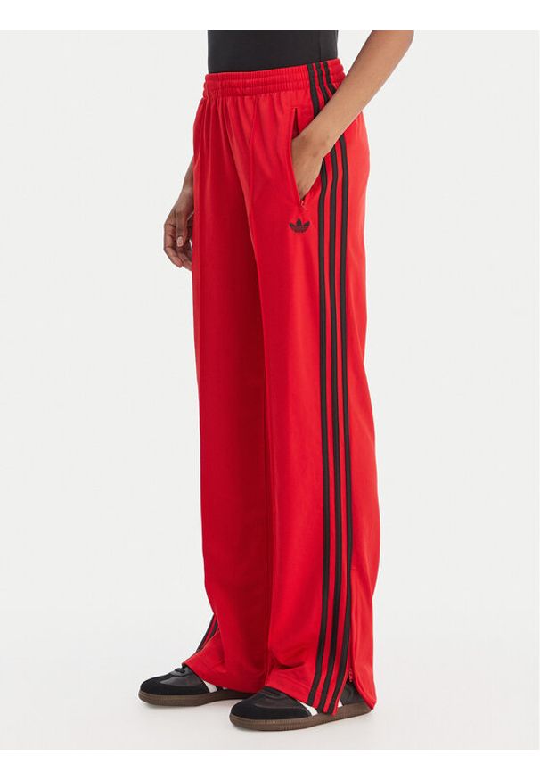 Adidas - adidas Spodnie dresowe Firebird Classic KD3648 Czerwony Regular Fit. Kolor: czerwony. Materiał: syntetyk