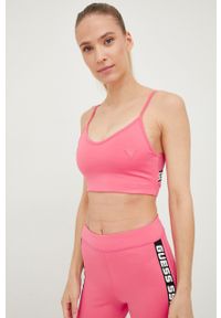 Guess biustonosz sportowy kolor różowy. Kolor: różowy. Materiał: skóra. Rodzaj stanika: odpinane ramiączka. Wzór: nadruk #2