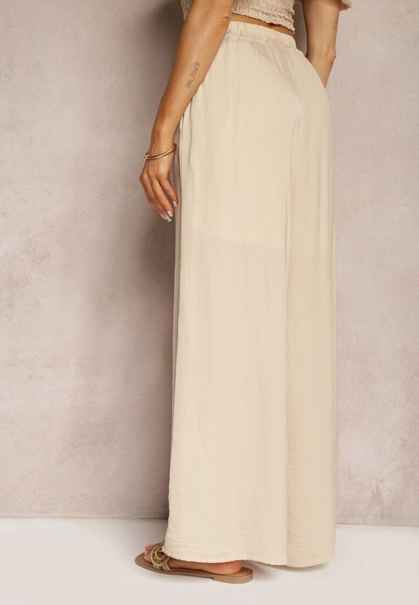 Renee - Beżowe Wiskozowe Spodnie Szerokie High Waist Rissalene. Okazja: do pracy, na spotkanie biznesowe. Stan: podwyższony. Kolor: beżowy. Materiał: wiskoza. Styl: elegancki, biznesowy