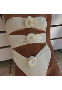 Intica - Jednoczęściowy kostium kąpielowy z florystycznym wzorem na lato Charlot. Kolor: beżowy. Materiał: materiał. Wzór: kwiaty