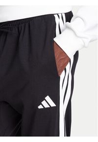 Adidas - adidas Spodnie dresowe Essentials 3-Stripes JE6430 Czarny Regular Fit. Kolor: czarny. Materiał: bawełna #4