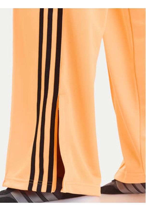Adidas - adidas Spodnie dresowe adicolor Classic Firebird JY2694 Żółty Loose Fit. Kolor: żółty. Materiał: syntetyk