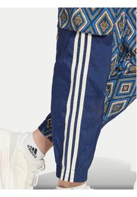 Adidas - adidas Spodnie dresowe FARM Rio Premium IV9760 Granatowy Loose Fit. Kolor: niebieski. Materiał: syntetyk