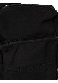 Calvin Klein Saszetka "CK Must+ Reporter" | K50K510275 BAX | Mężczyzna | Czarny. Kolor: czarny. Materiał: poliester, poliamid