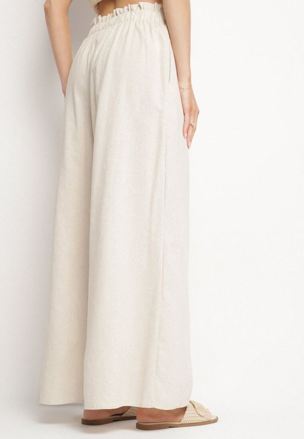 Born2be - Beżowe Szerokie Spodnie z Bawełny z Wysokim Stanem z Troczkiem Nelseli. Okazja: na co dzień. Stan: podwyższony. Kolor: beżowy. Materiał: bawełna. Styl: casual