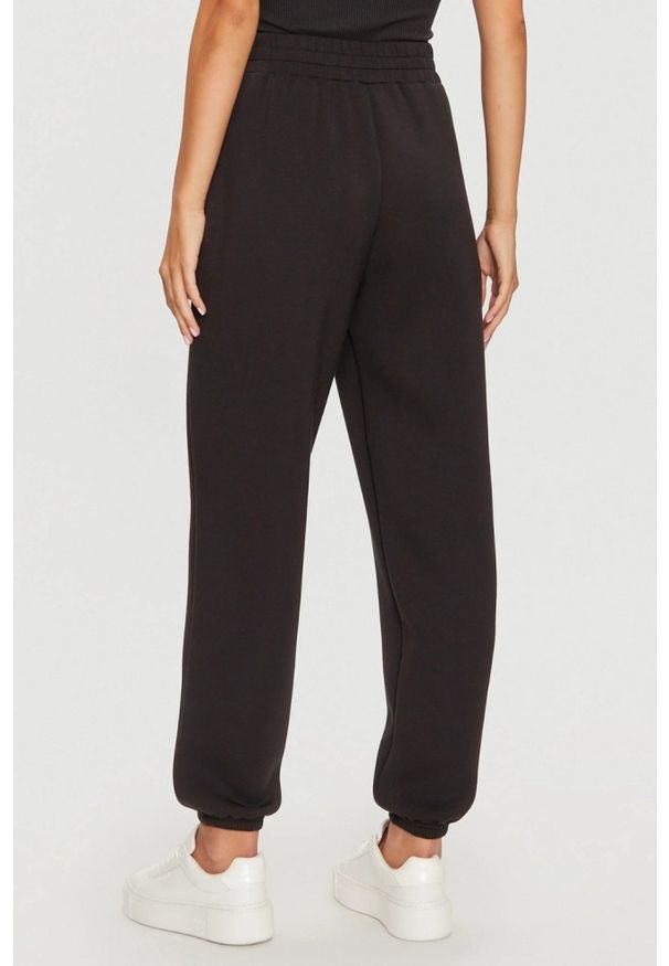 Guess - GUESS Czarne damskie spodnie dresowe Cecilia, Rozmiar S. Kolor: czarny. Materiał: dresówka