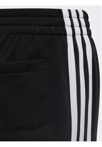 Adidas - adidas Spodnie dresowe adidas Essential 3-Stripes Joggers H65796 Czarny Regular Fit. Kolor: czarny. Materiał: bawełna