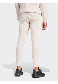 Adidas - adidas Spodnie dresowe Future Icons 3-Stripes IR9155 Różowy Slim Fit. Kolor: różowy. Materiał: bawełna #3