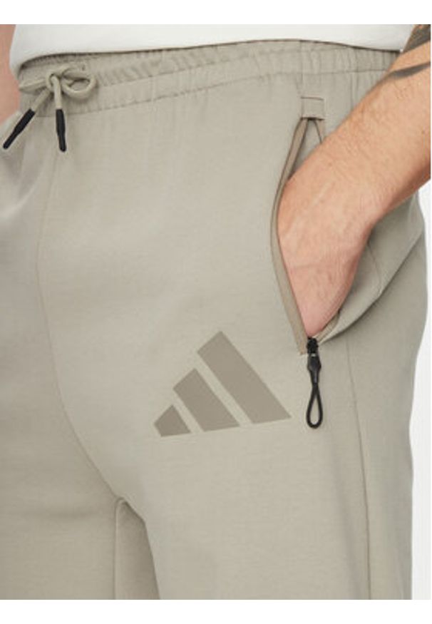 Adidas - adidas Spodnie dresowe Z.N.E. Open-Hem JC6716 Beżowy Loose Fit. Kolor: beżowy. Materiał: syntetyk, bawełna