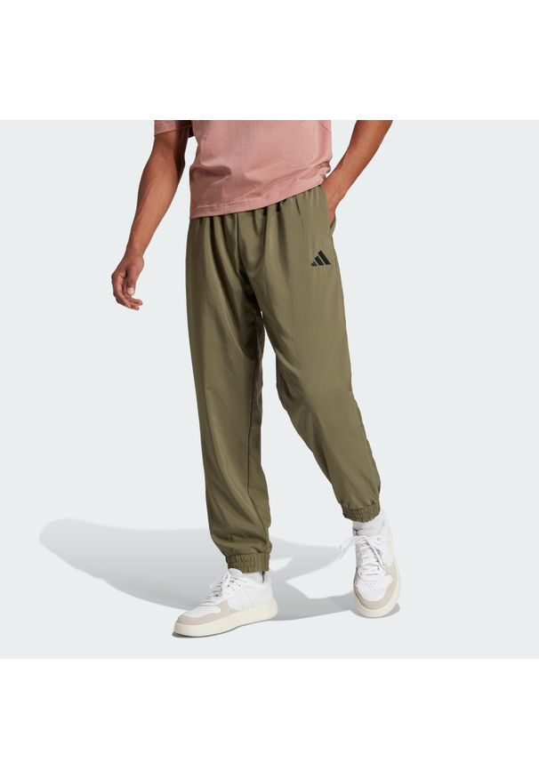 Adidas - Spodnie Essentials Small Logo Stanford. Kolor: beżowy, wielokolorowy, czarny. Materiał: materiał. Sport: fitness