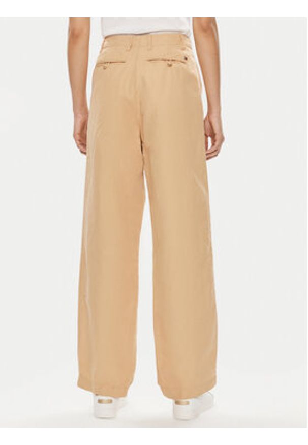 TOMMY HILFIGER - Tommy Hilfiger Spodnie materiałowe WW0WW41355 Beżowy Relaxed Fit. Kolor: beżowy. Materiał: bawełna