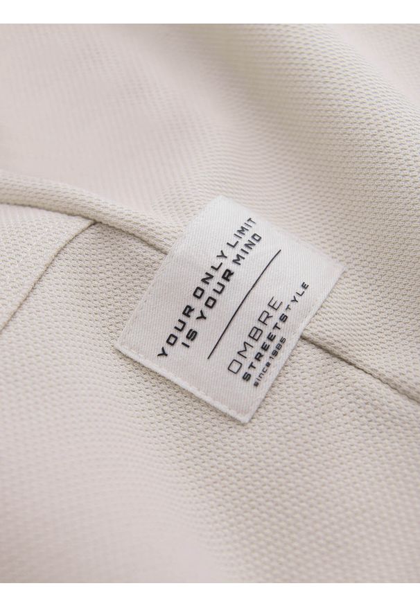 Ombre Clothing - Męskie spodnie dresowe ze strukturalnej dzianiny - jasnobeżowe V1 - Rozmiar: L. Kolor: beżowy. Materiał: dresówka, dzianina. Wzór: melanż, aplikacja, ze splotem. Styl: elegancki