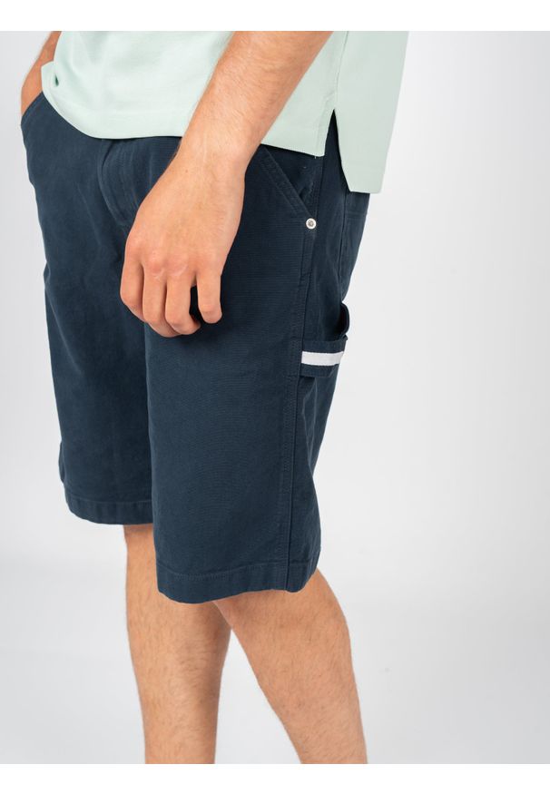 TOMMY HILFIGER - Tommy Jeans Szorty "Skater Jean Loose" | DM0DM13226 | Mężczyzna | Granatowy. Stan: podwyższony. Kolor: niebieski. Materiał: bawełna, elastan. Wzór: aplikacja