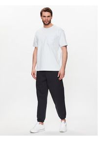 New Balance Spodnie dresowe MP23551 Czarny Relaxed Fit. Kolor: czarny. Materiał: dresówka, bawełna