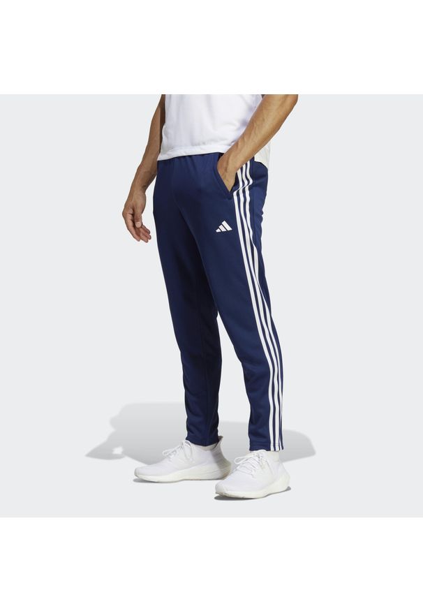 Adidas - Train Essentials 3-Stripes Training Pants. Kolor: biały, niebieski, wielokolorowy. Materiał: dresówka, materiał