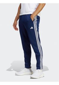 Adidas - Spodnie dresowe adidas. Kolor: niebieski. Materiał: dresówka, syntetyk #1