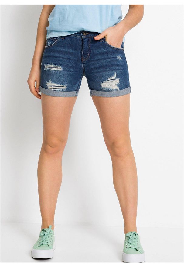 bonprix - Szorty dżinsowe mid waist z ozdobnymi przetarciami. Kolor: niebieski