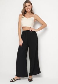 Born2be - Czarne Spodnie Palazzo o Szerokim Kroju z Wysokim Stanem Aravenna. Okazja: na co dzień. Stan: podwyższony. Kolor: czarny. Wzór: aplikacja. Styl: casual, elegancki #4
