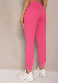 Renee - Fuksjowe Spodnie Dresowe Typu Joggery z Kieszeniami na Suwak Fellina. Okazja: na co dzień. Kolor: różowy. Materiał: dresówka. Styl: klasyczny, casual, elegancki