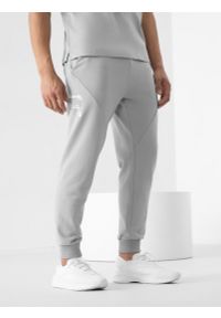 4f - Spodnie dresowe joggery z bawełny organicznej męskie 4F x Robert Lewandowski. Kolor: szary. Materiał: bawełna, dresówka. Wzór: nadruk. Sport: fitness #2