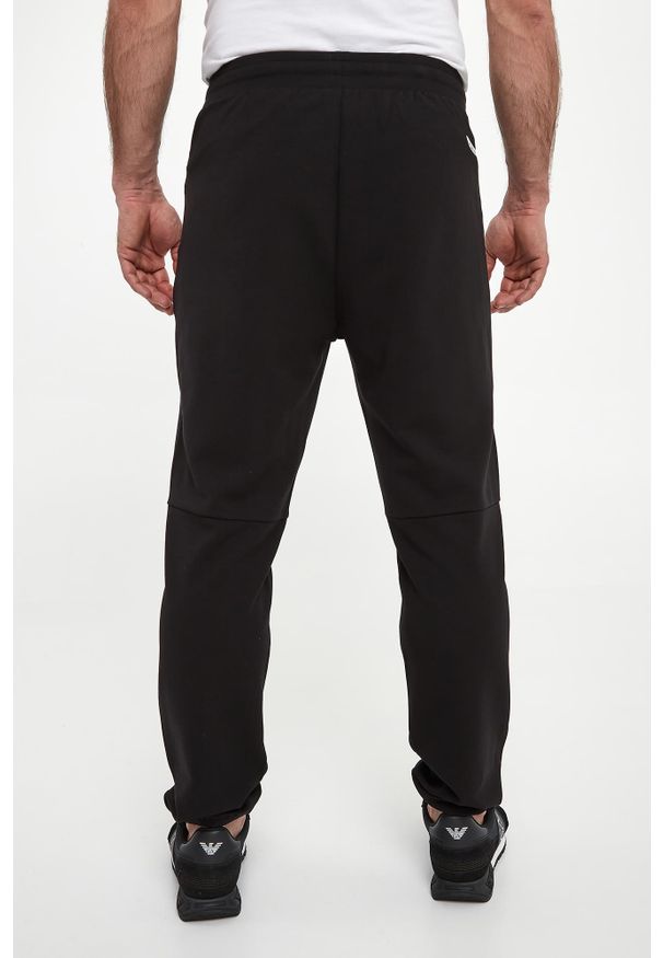 EA7 Emporio Armani - Spodnie dresowe męskie EA7 EMPORIO ARMANI. Materiał: dresówka