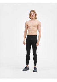 4f - Legginsy do biegania szybkoschnące męskie. Kolor: czarny. Materiał: guma, tkanina, materiał, skóra. Wzór: gładki. Sport: fitness