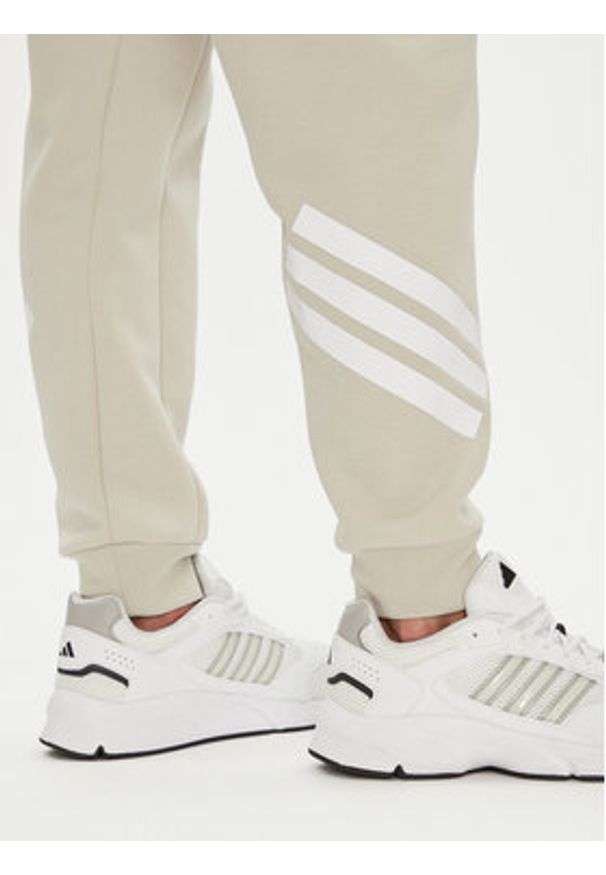 Adidas - adidas Spodnie dresowe Future Icons 3-Stripes JW7092 Beżowy Regular Fit. Kolor: beżowy. Materiał: bawełna