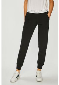 Calvin Klein Jeans - Spodnie. Kolor: czarny. Materiał: bawełna, poliester, dzianina. Wzór: gładki, melanż #1