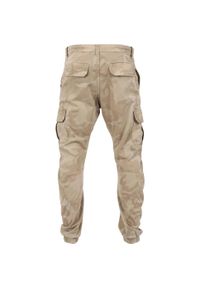 Urban Classics - Męskie Spodnie Joggingowe Camo Cargo. Kolor: zielony, wielokolorowy, brązowy