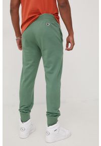 Champion spodnie męskie kolor zielony z aplikacją. Kolor: zielony. Materiał: dzianina, włókno. Wzór: aplikacja