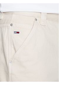 Tommy Jeans Szorty jeansowe Aiden DM0DM16159 Beżowy Baggy Fit. Kolor: beżowy. Materiał: bawełna