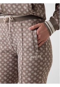 Guess Spodnie materiałowe 176829 Brązowy Slim Fit. Kolor: brązowy. Materiał: materiał #4