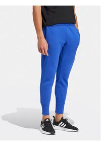Adidas - adidas Spodnie dresowe Z.N.E. Premium IR5206 Niebieski Regular Fit. Kolor: niebieski. Materiał: bawełna, syntetyk