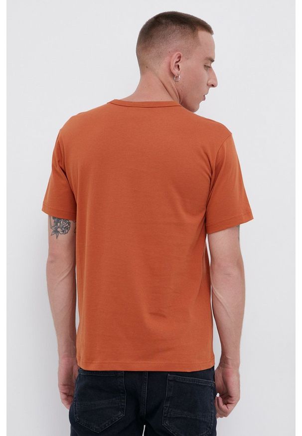 Champion - T-shirt bawełniany. Okazja: na co dzień. Kolor: pomarańczowy. Materiał: bawełna. Wzór: gładki, aplikacja. Styl: casual