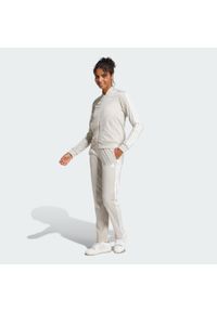 Adidas - Dres Essentials 3-Stripes. Kolor: beżowy. Materiał: dresówka