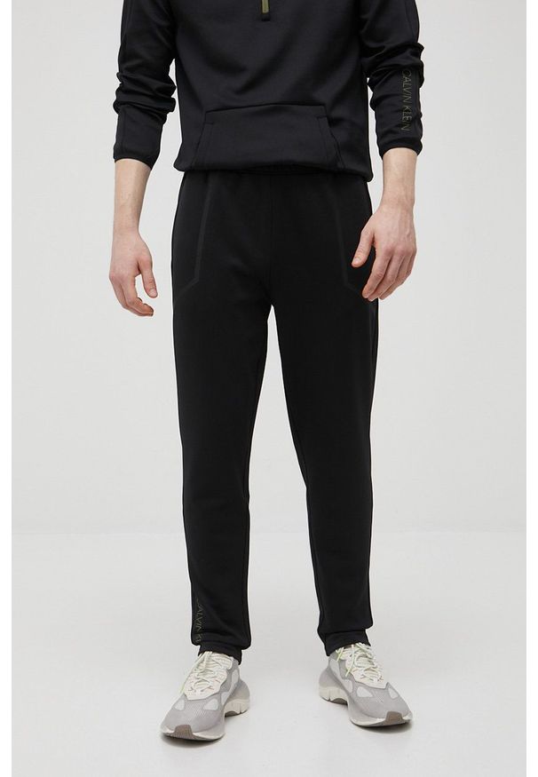 Calvin Klein Performance spodnie treningowe męskie kolor czarny z nadrukiem. Kolor: czarny. Materiał: dzianina. Wzór: nadruk