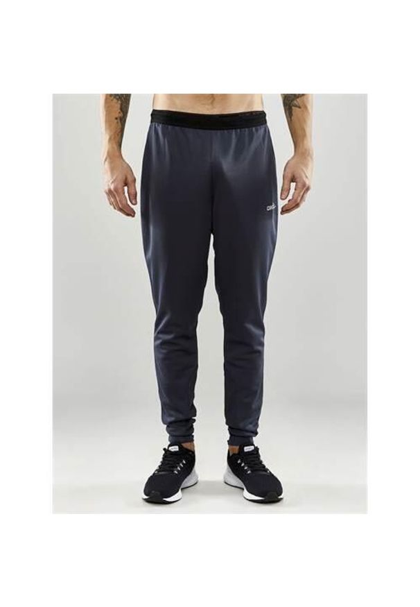 Spodnie treningowe męskie Craft Evolve Slim. Kolor: szary. Materiał: dresówka. Sport: fitness