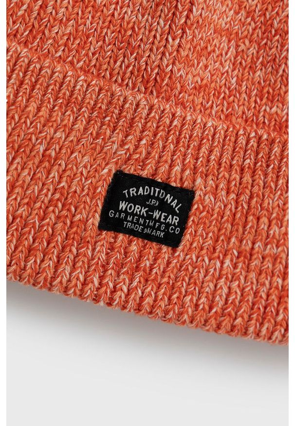 Superdry Czapka bawełniana kolor pomarańczowy z grubej dzianiny. Kolor: pomarańczowy. Materiał: dzianina, bawełna