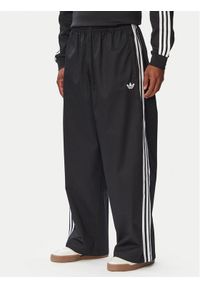 Adidas - adidas Spodnie dresowe Adicolor SST Cotton Twill KR1387 Czarny Relaxed Fit. Kolor: czarny. Materiał: bawełna #1