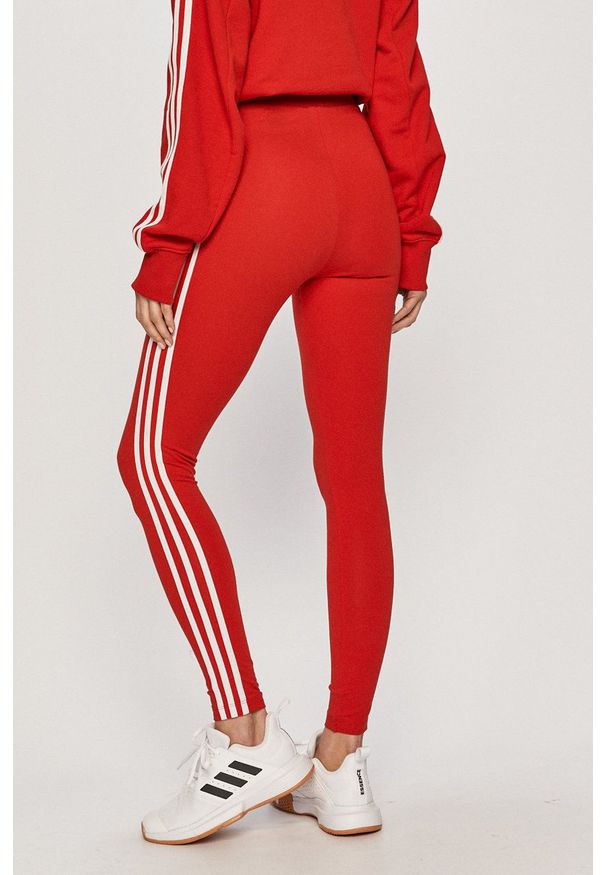 adidas Originals - Legginsy. Kolor: czerwony. Materiał: dzianina