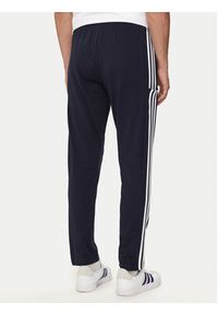 Adidas - adidas Spodnie dresowe Essentials IC0045 Granatowy Regular Fit. Kolor: niebieski. Materiał: bawełna, syntetyk #2