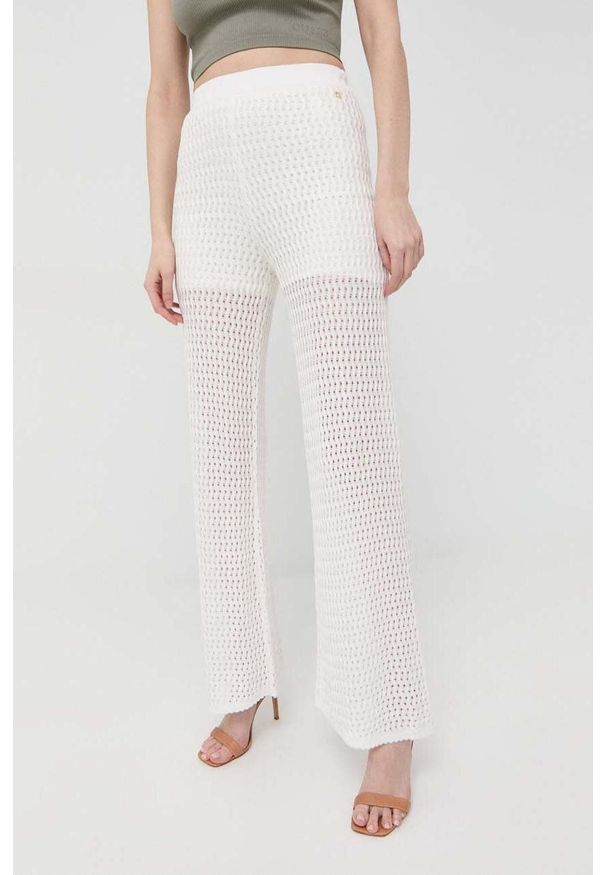 Guess spodnie damskie kolor biały szerokie high waist. Stan: podwyższony. Kolor: biały. Materiał: materiał