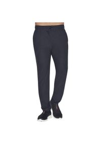 skechers - Spodnie sportowe męskie Skechers Ultra Go Lite Tapered Pant. Kolor: niebieski. Materiał: poliester, elastan