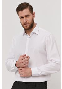 Calvin Klein - Koszula bawełniana. Okazja: na co dzień. Kolor: biały. Materiał: bawełna. Długość rękawa: długi rękaw. Długość: długie. Wzór: gładki. Styl: casual