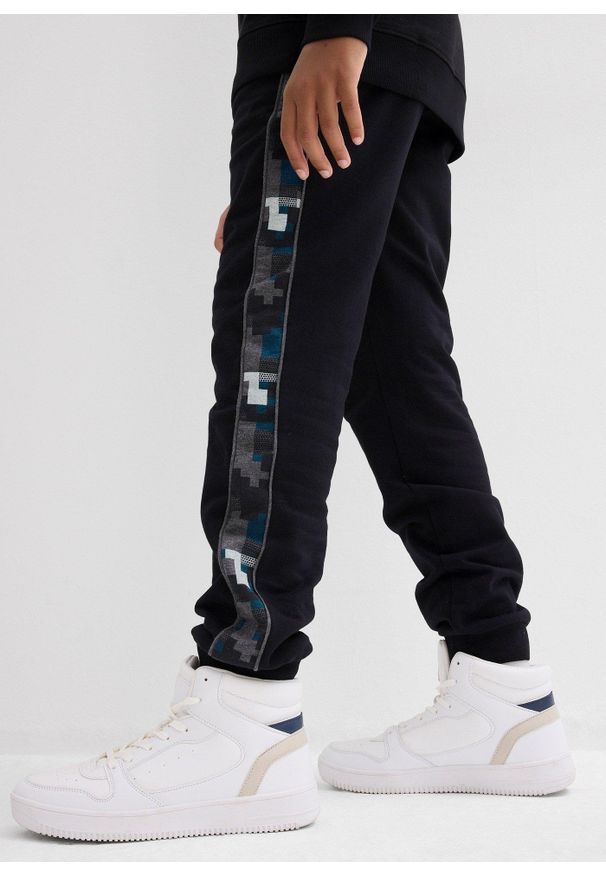 bonprix - Spodnie dresowe z bawełny organicznej. Kolor: czarny. Materiał: bawełna, dresówka