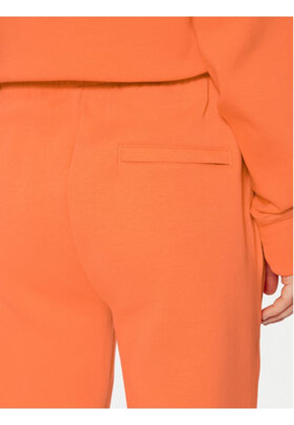 Lacoste Spodnie dresowe XF0343 Pomarańczowy Regular Fit. Kolor: pomarańczowy. Materiał: bawełna
