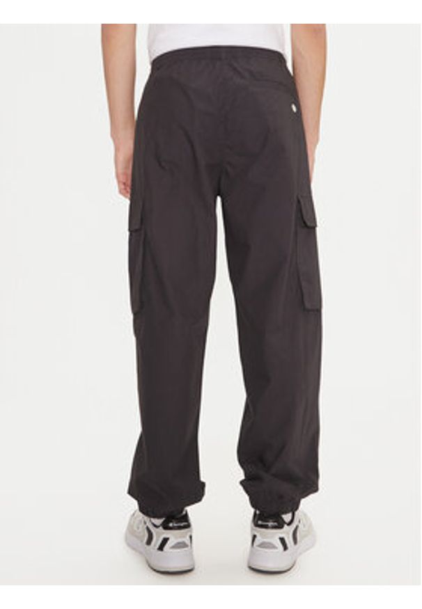 Champion Spodnie dresowe 220415 Czarny Loose Fit. Kolor: czarny. Materiał: bawełna