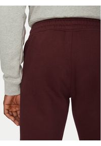 Adidas - adidas Spodnie dresowe Trefoil Essentials JD2420 Bordowy Slim Fit. Kolor: czerwony. Materiał: bawełna