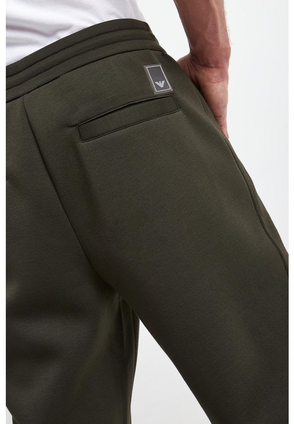 Emporio Armani - Spodnie dresowe męskie EMPORIO ARMANI. Materiał: dresówka