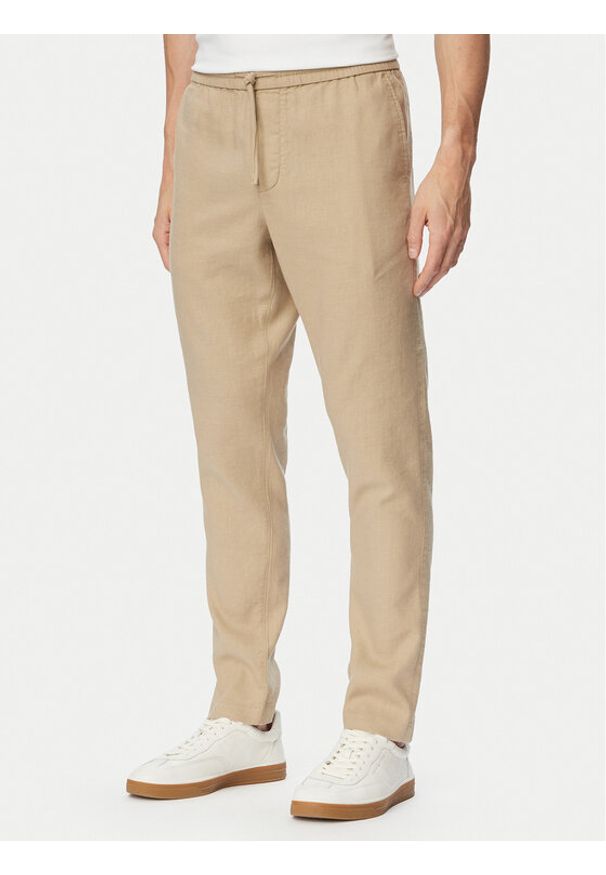 TOMMY HILFIGER - Tommy Hilfiger Chinosy Harlem MW0MW42336 Beżowy Regular Fit. Kolor: beżowy. Materiał: len